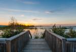 a sunset view from one of collingwood's many scenic boardwalks near or on georgian bay.