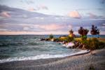 view toward Collingwood's iconic inukshuk at sunset point park, during sunset