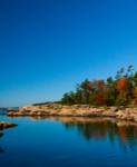 Colorful fall view from a small island on Georgian Bay near Muskoka region.